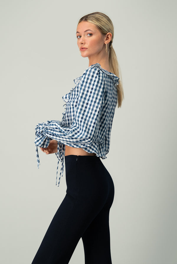 Blusa con corte peplum en cintura manga larga