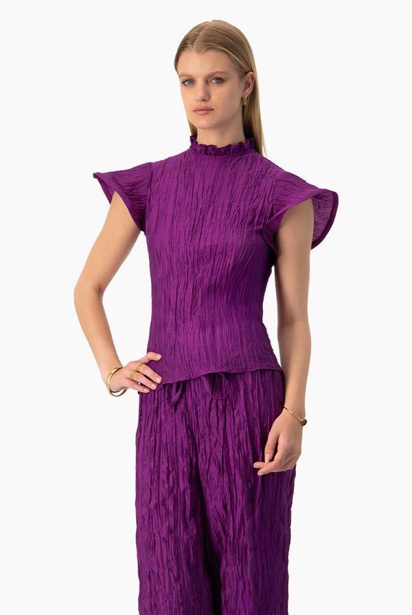 Blusa recta en tono morado