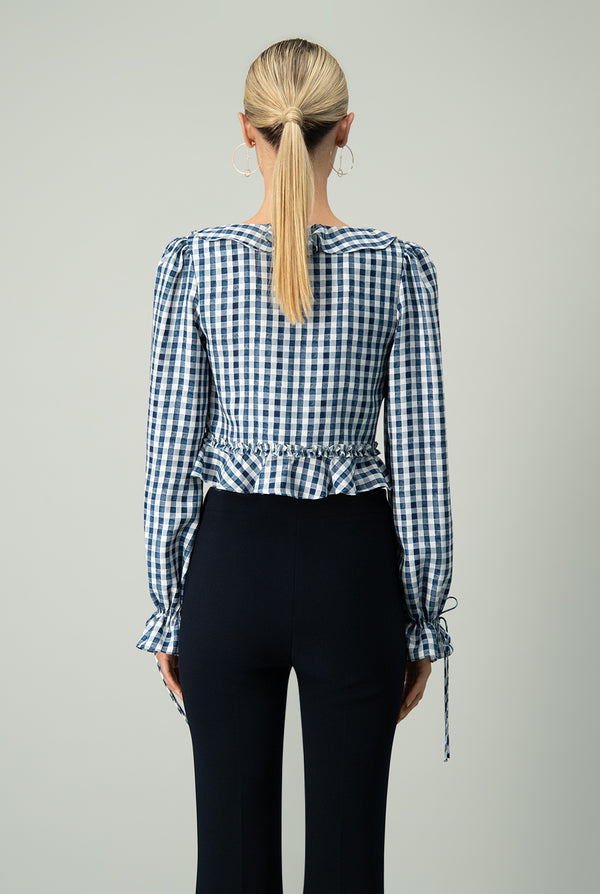 Blusa con corte peplum en cintura manga larga