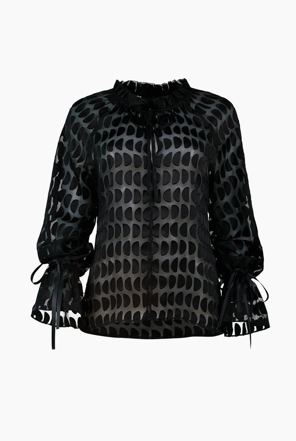 Blusa con transparencias de manga larga y cuello alto