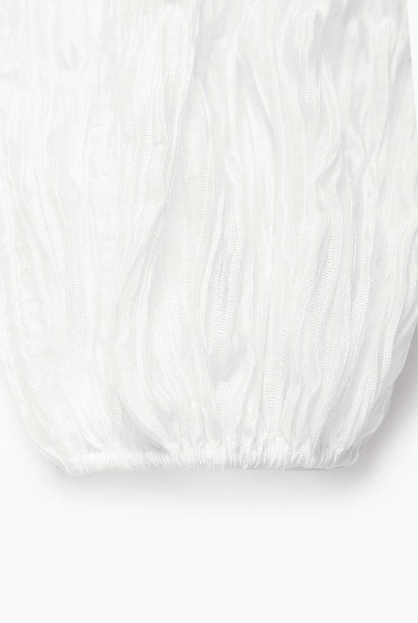Blusa blanca de moño en cuello