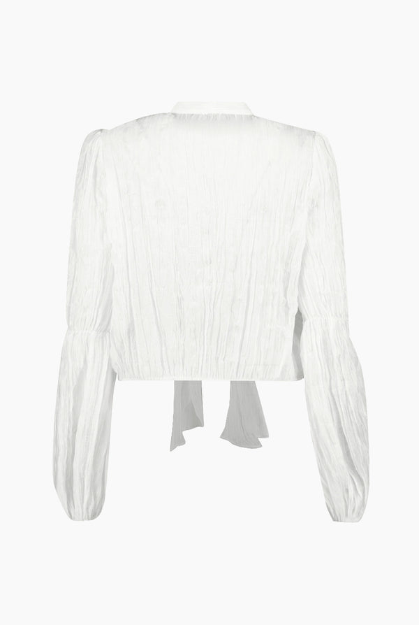 Blusa blanca de moño en cuello